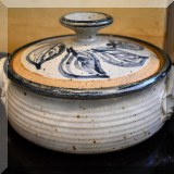 K06. Signed pottery covered casserole dish. Chip on lid. - $16